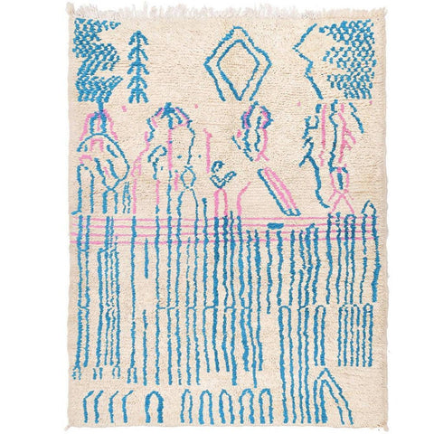 Detail close-up of an abstract Moroccan rug featuring beige, blue, and pink colors.