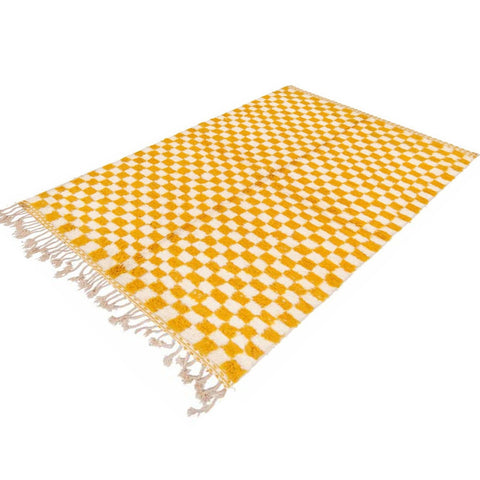 Side view of the yellow checkered Beni Ourain rug highlighting its checkered pattern.