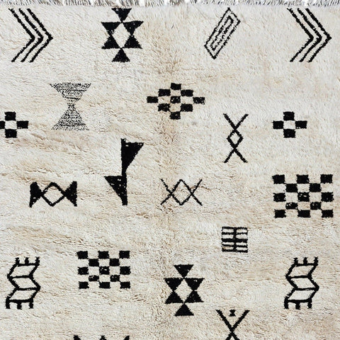 Detail close-up of a Moroccan Tribal Custom Rug with geometric patterns in black and white.