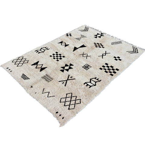 Front view of a black and white Moroccan Tribal Custom Rug showcasing tribal patterns on a solid background.