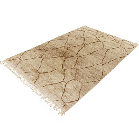 Side view of the pink abstract Moroccan Berber rug displaying its colors and design.