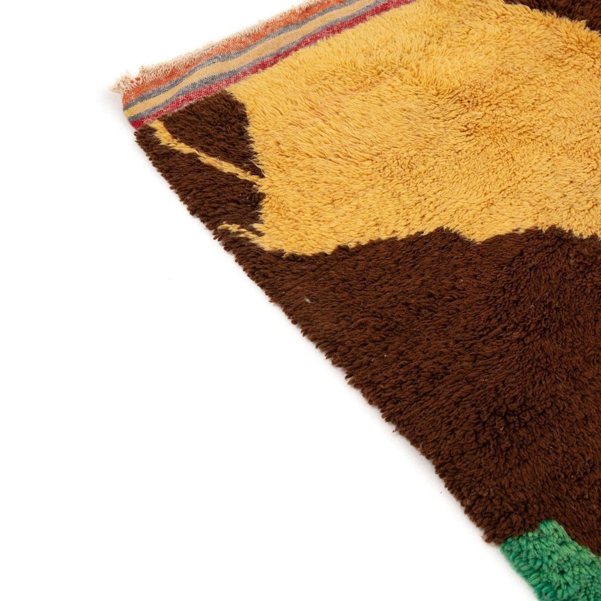 Detailed view of the orange rug highlighting its abstract design.