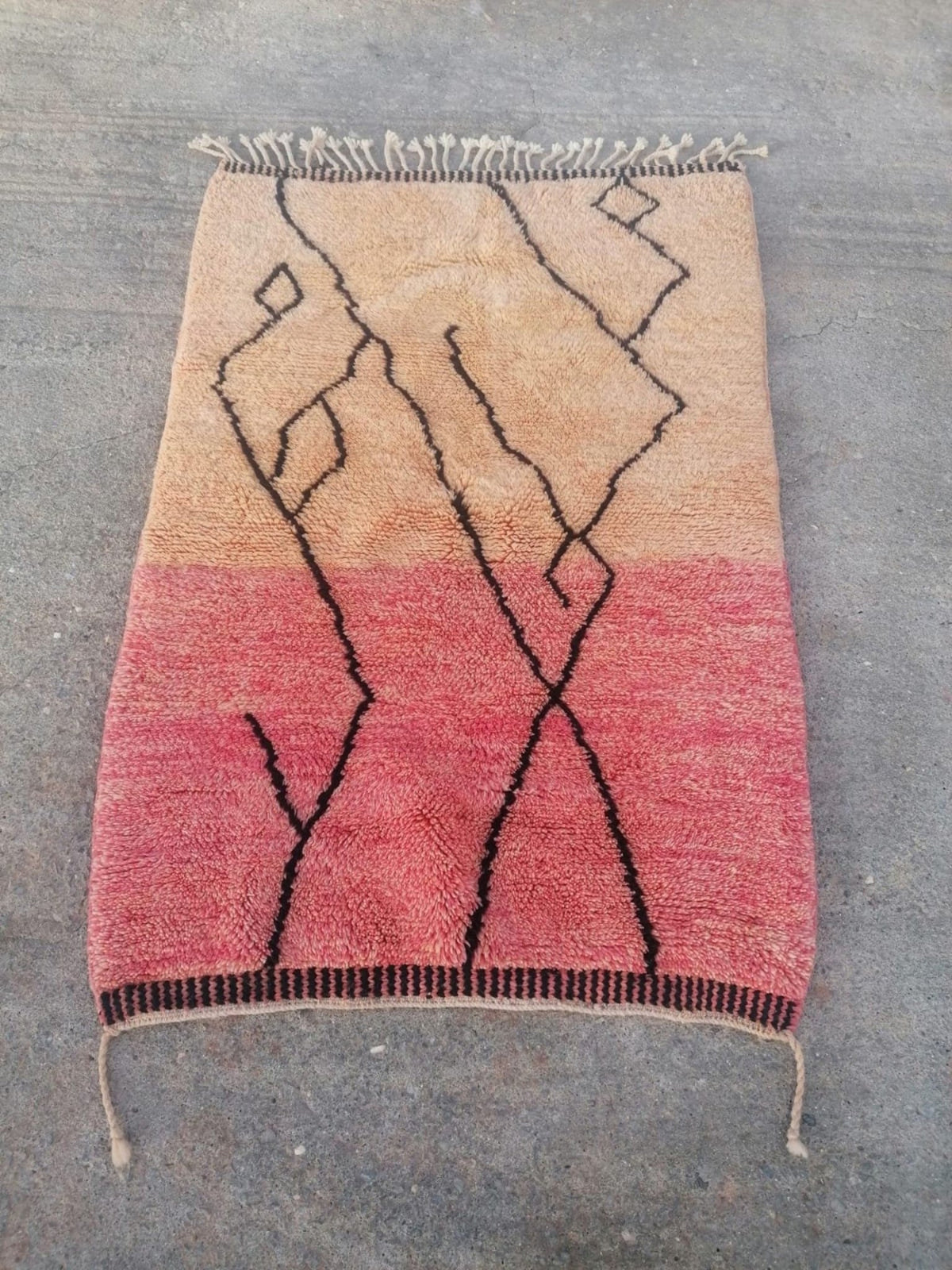 Front view of the pink Moroccan rug highlighting its geometric pattern and color details.