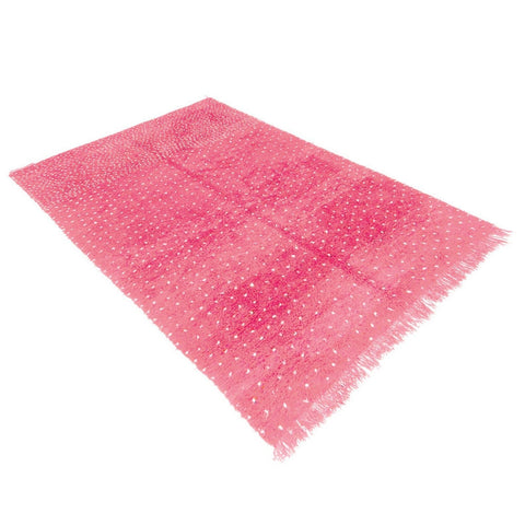 Front view of the pink Beni Ourain rug with white dots displayed on a white surface.