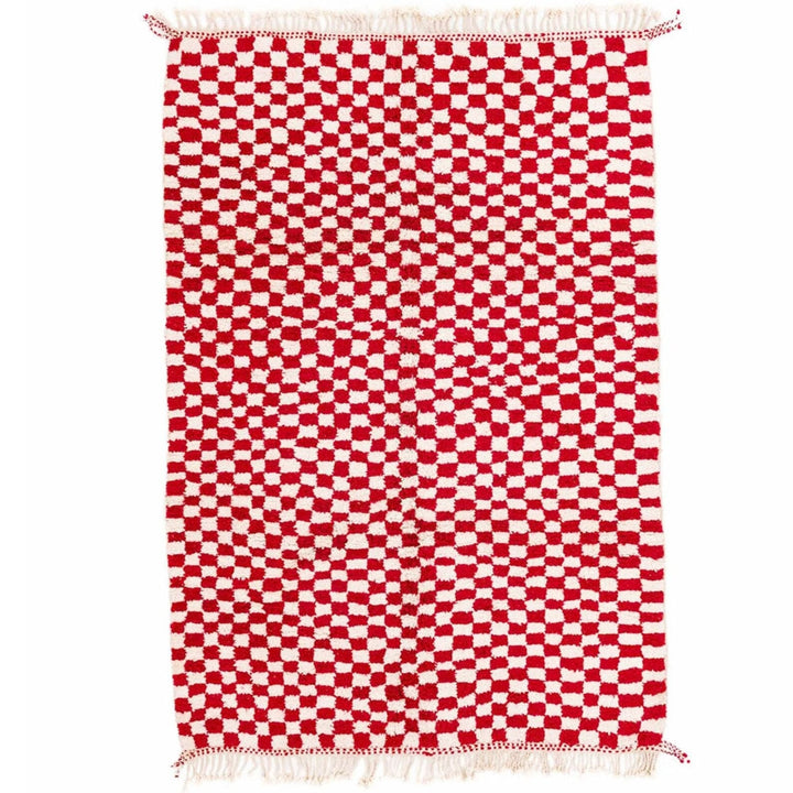 Front view of the pink checkered Moroccan rug featuring fringe edges.