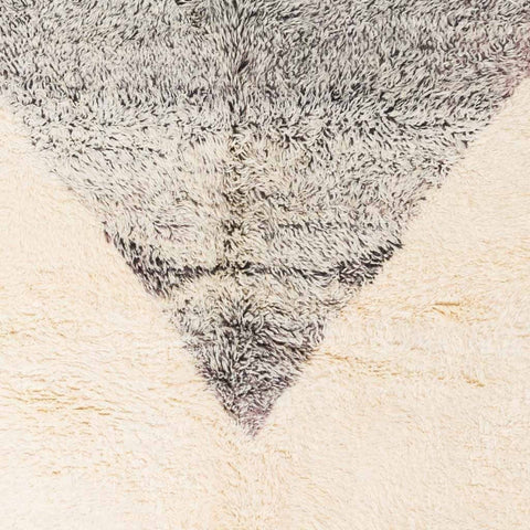 Detail close-up showing the textured surface and soft fibers of the rug.