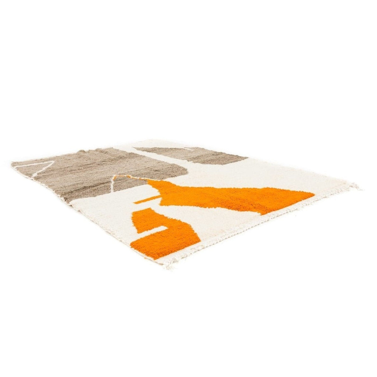 Lifestyle shot of the orange and beige abstract Moroccan rug in a natural setting.
