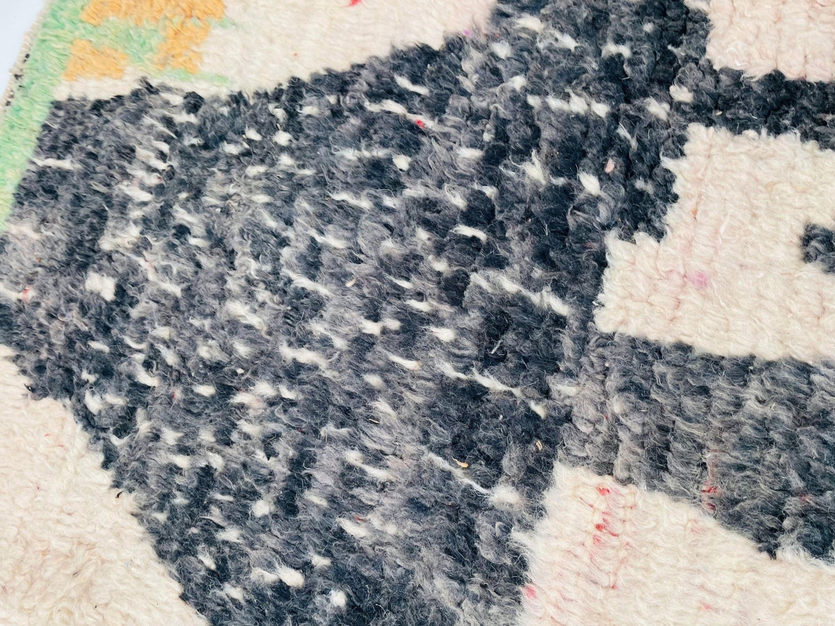Detail view of the abstract pattern on the Moroccan rug in black and white.
