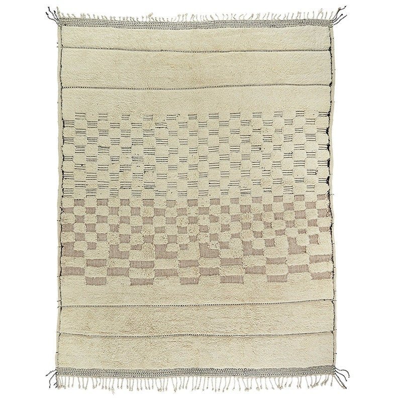 Detail shot of off-white textured Beni Ourain Moroccan rug with a patterned design.