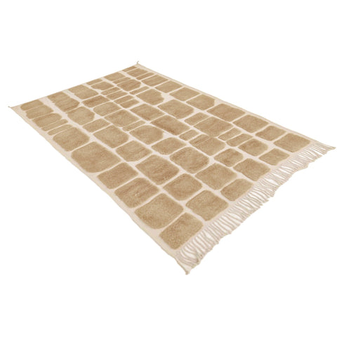 Side view of a textured Moroccan rug showcasing its geometric pattern and fringed edges.