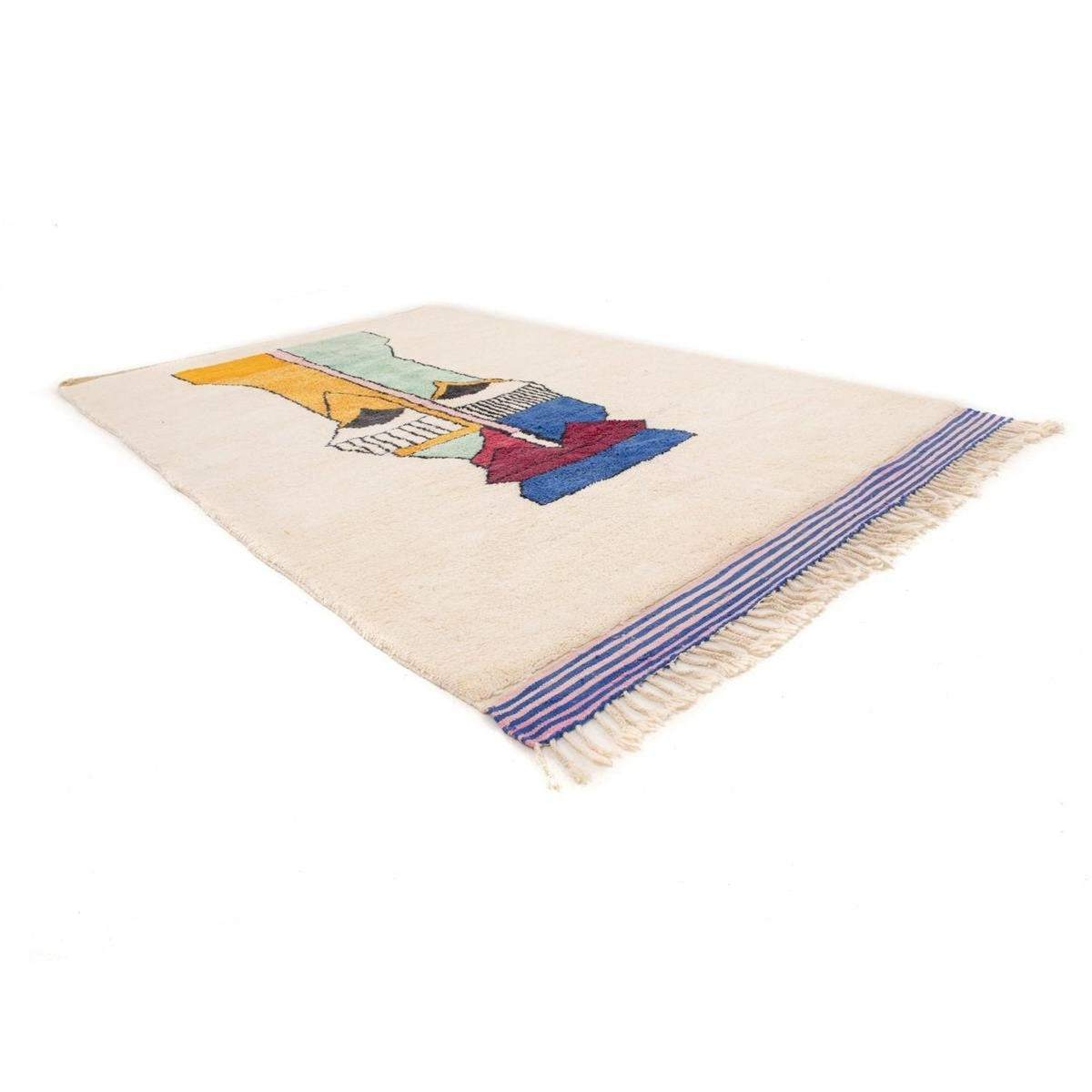 Side view of the area rug displaying geometric pattern and fringed edges.