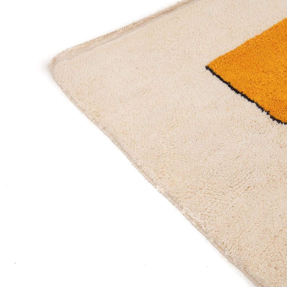 Close-up of the artsy face rug showing minimalist design and soft texture.