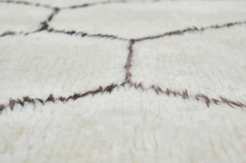 Front view of the black and off-white Beni Ourain Moroccan rug showcasing its abstract design.