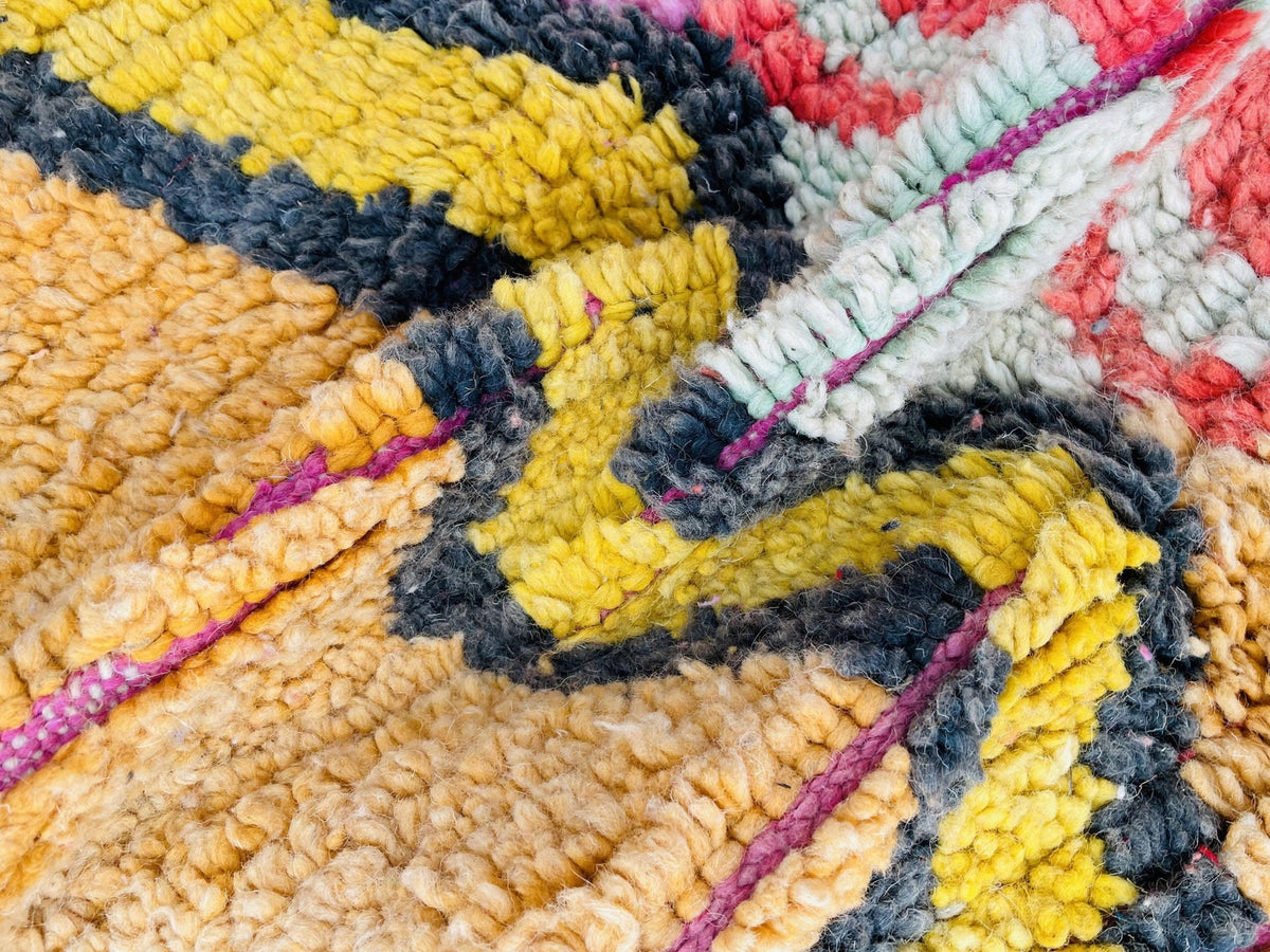 Lifestyle view of the orange and pink abstract Moroccan rug showcasing its intricate geometric patterns.