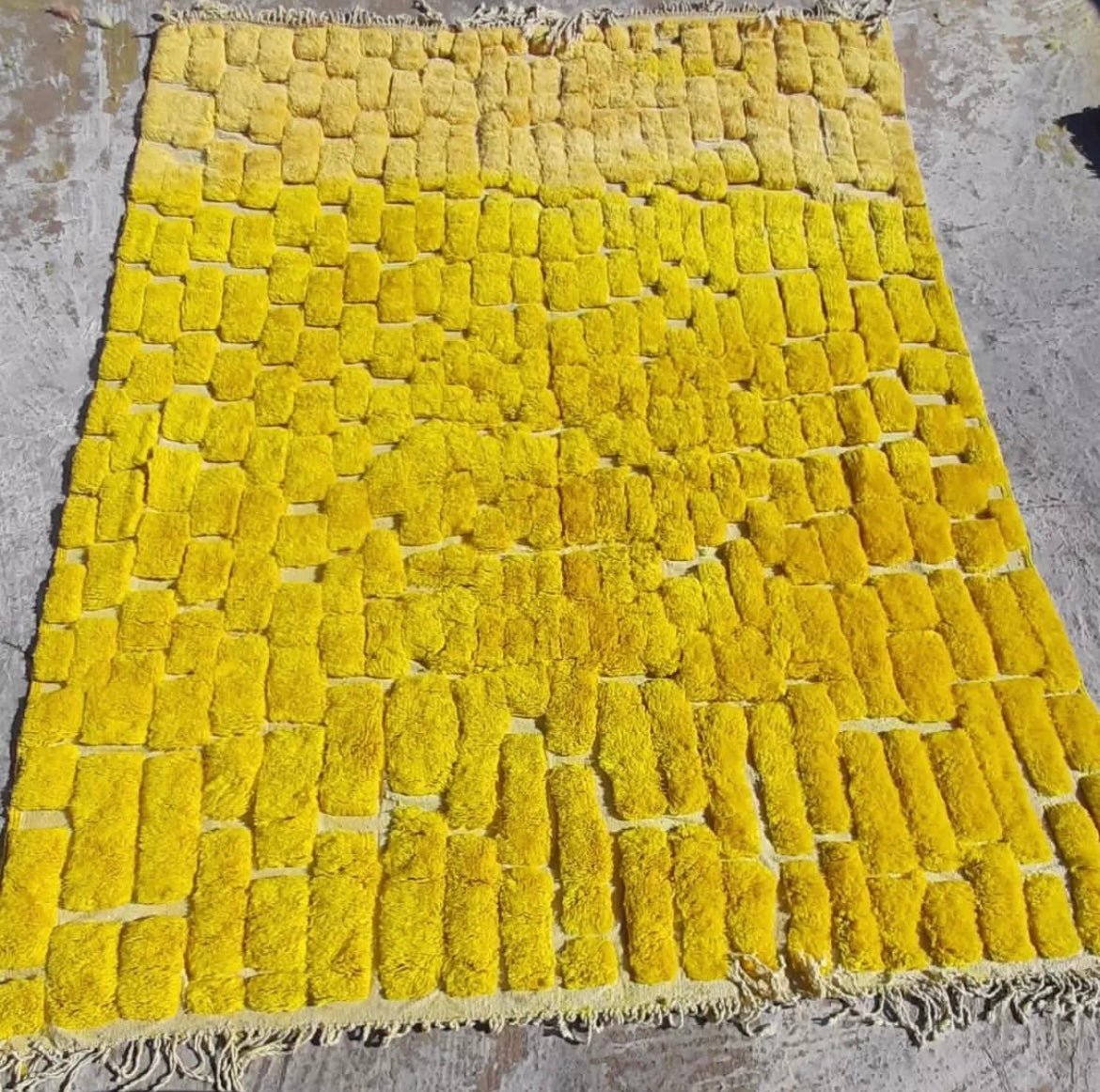 Front view of the yellow Berber rug displaying its unique pattern and soft texture.