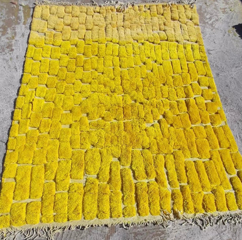 Front view of the yellow Berber rug displaying its unique pattern and soft texture.