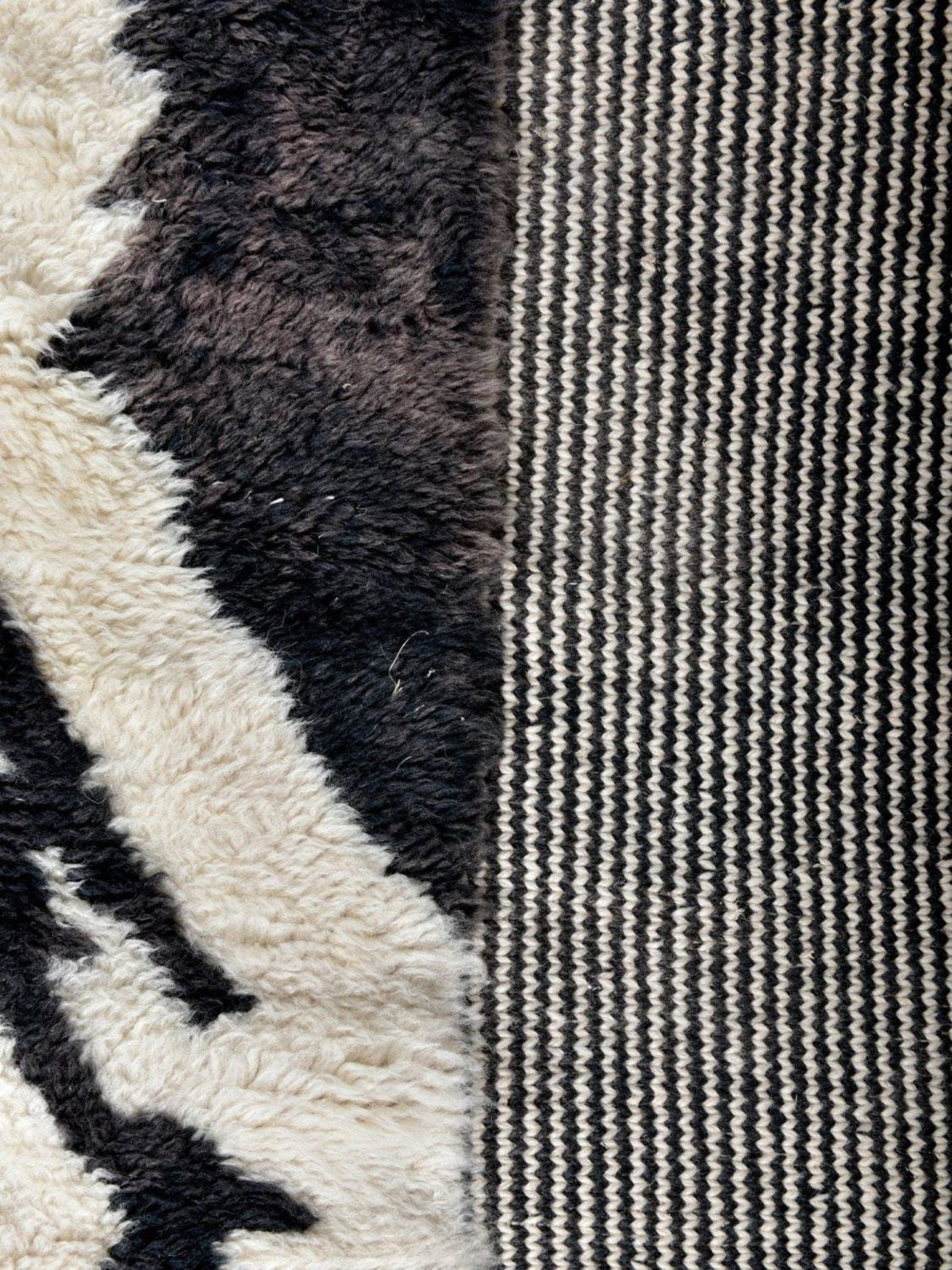 Close-up detail of the zebra print rug highlighting its textured surface and abstract design.